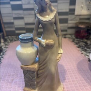 Elegant Figurine with Vase